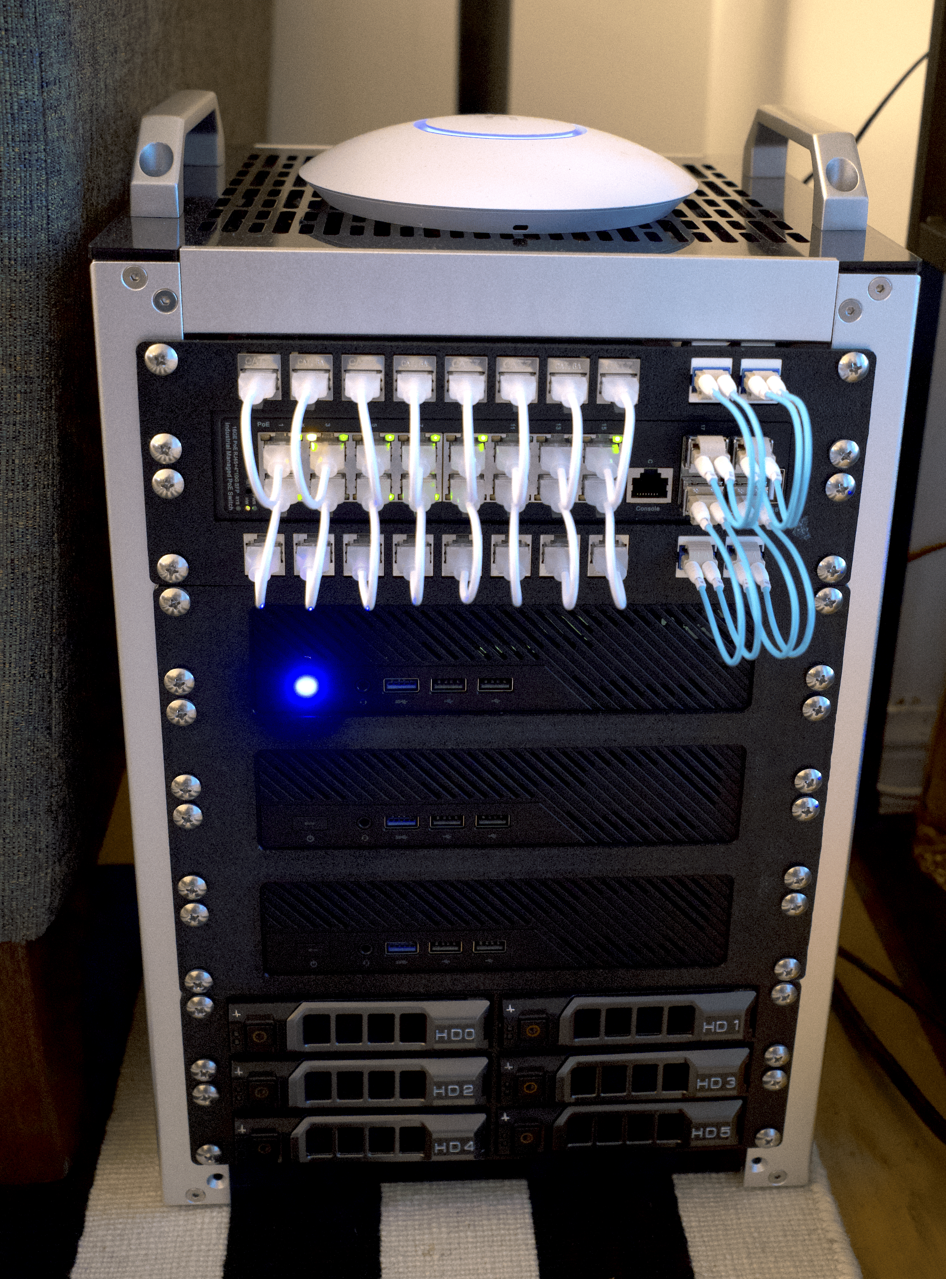 A picture of the half-width network rack, with the hardware mounted